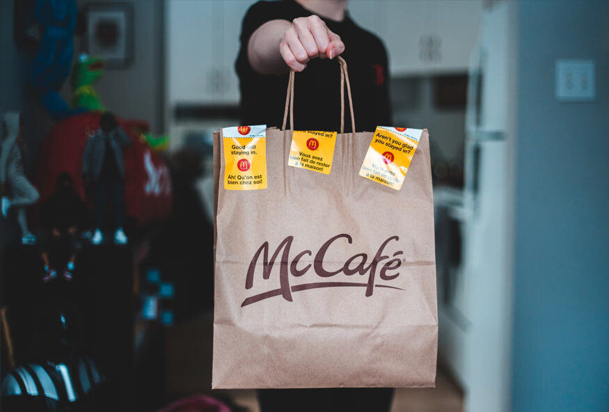 guy showing a mcafe bag