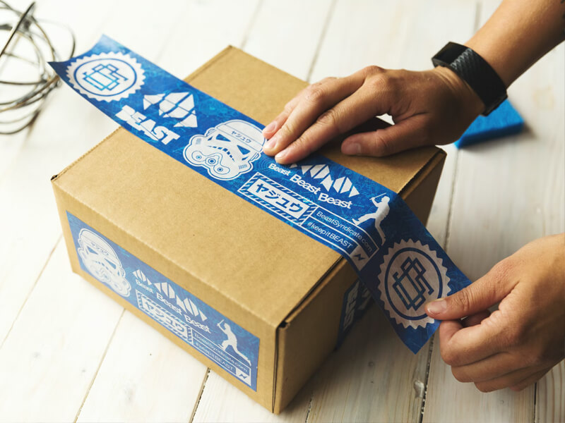 courier people wrapping a package